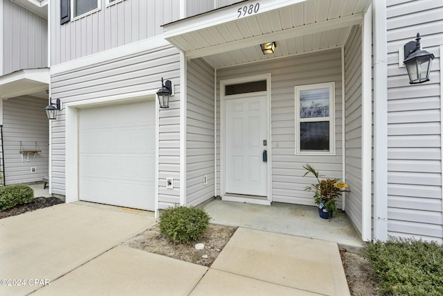 property entrance featuring a garage