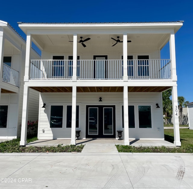 back of house with a patio area, a balcony, and french doors