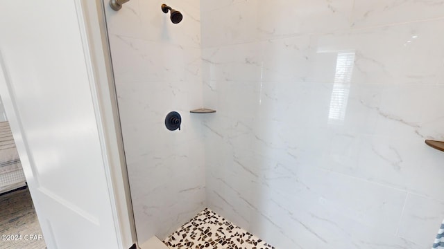 bathroom with a tile shower