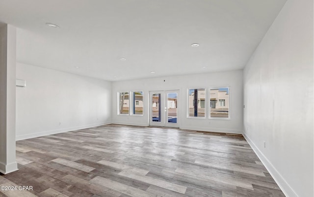 unfurnished living room with light hardwood / wood-style floors