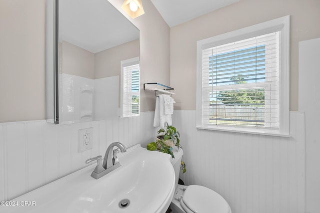 bathroom featuring toilet and sink