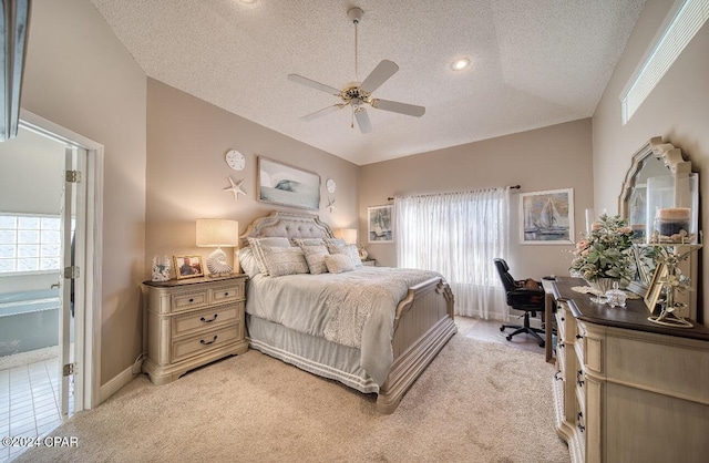 carpeted bedroom with ceiling fan, a textured ceiling, and high vaulted ceiling