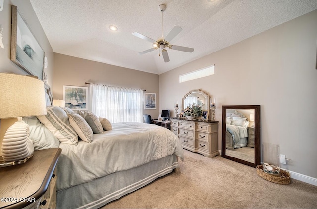 bedroom featuring a textured ceiling, light colored carpet, ceiling fan, and lofted ceiling