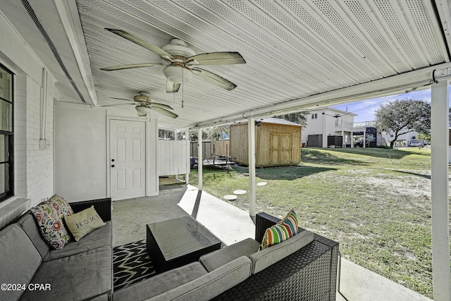 view of patio with an outdoor hangout area and a storage unit