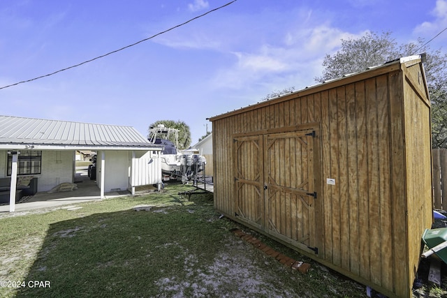 view of outdoor structure with a lawn