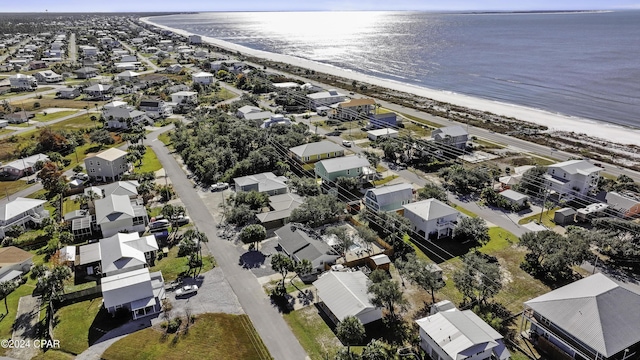 drone / aerial view featuring a view of the beach and a water view