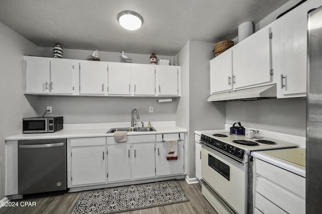 kitchen with white cabinetry, sink, dark hardwood / wood-style floors, and appliances with stainless steel finishes