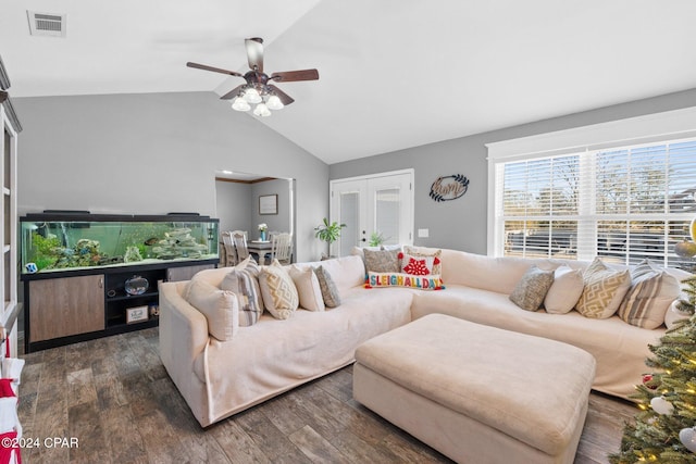 living room with ceiling fan, dark hardwood / wood-style flooring, lofted ceiling, and french doors