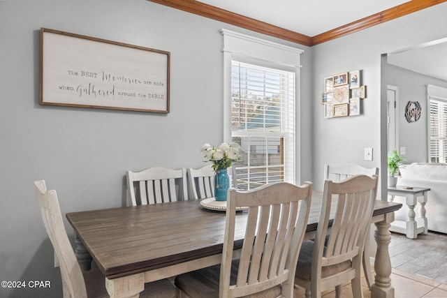 dining space featuring ornamental molding