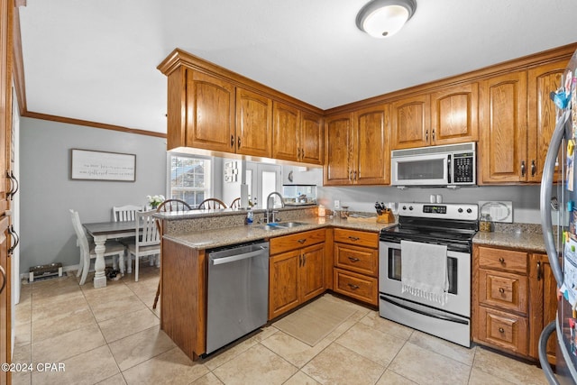 kitchen featuring crown molding, sink, light tile patterned flooring, and stainless steel appliances