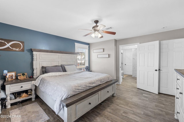 bedroom with hardwood / wood-style flooring and ceiling fan