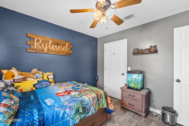 bedroom featuring ceiling fan and light hardwood / wood-style floors