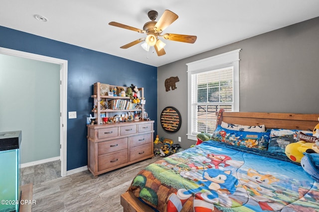 bedroom featuring ceiling fan and light wood-type flooring