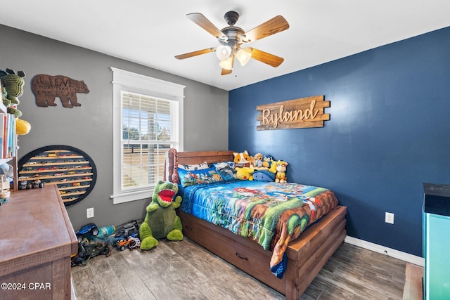 bedroom featuring hardwood / wood-style floors and ceiling fan