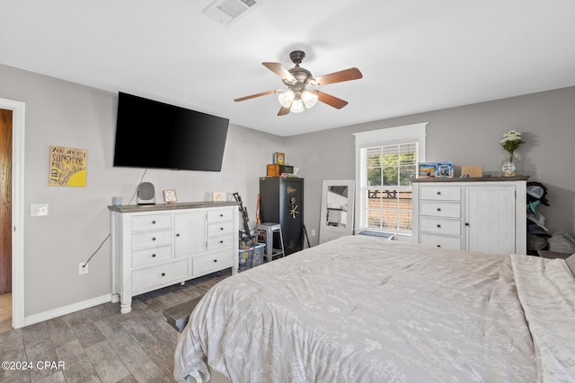 bedroom featuring hardwood / wood-style flooring and ceiling fan