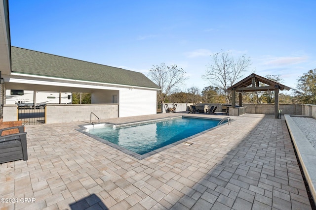 view of swimming pool featuring a gazebo and a patio