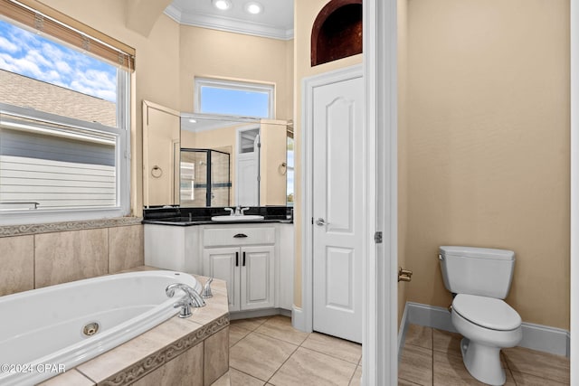 full bathroom with ornamental molding, vanity, independent shower and bath, tile patterned flooring, and toilet