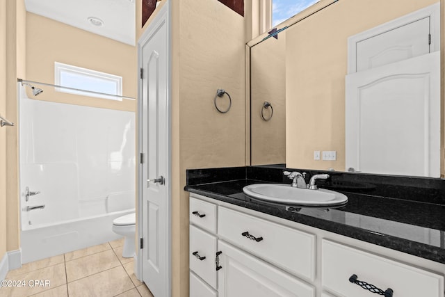 full bathroom featuring tile patterned floors, vanity, toilet, and shower / tub combination