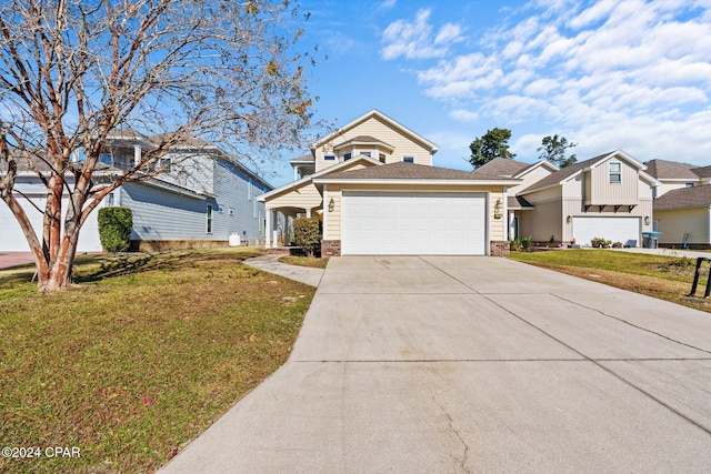 view of front of house with a front lawn and a garage