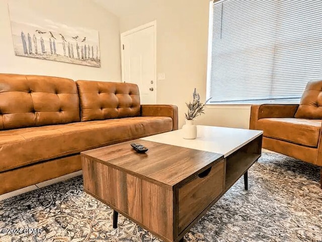 living room featuring vaulted ceiling