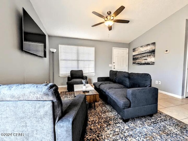 living room with light tile patterned floors, vaulted ceiling, and ceiling fan