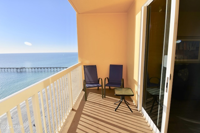 balcony featuring a water view