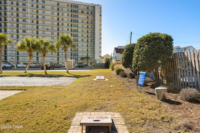 view of property's community with a lawn