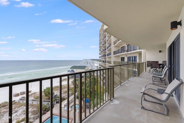 balcony with a view of the beach and a water view