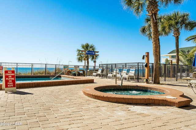 view of community featuring a jacuzzi