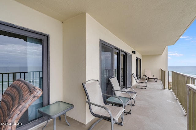 balcony featuring a water view