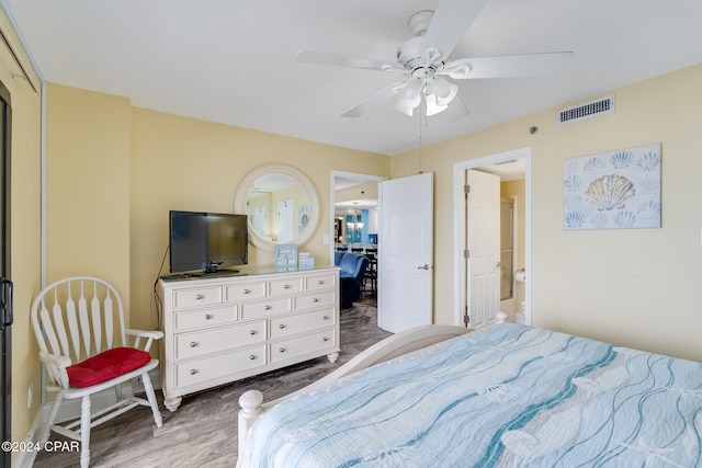 bedroom with hardwood / wood-style floors and ceiling fan