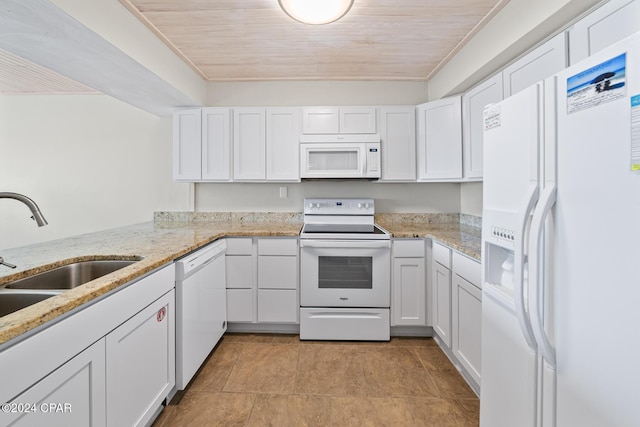 kitchen with white cabinetry and white appliances