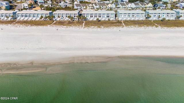 aerial view with a water view and a view of the beach