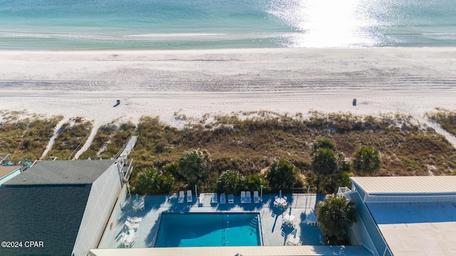 aerial view featuring a water view and a beach view