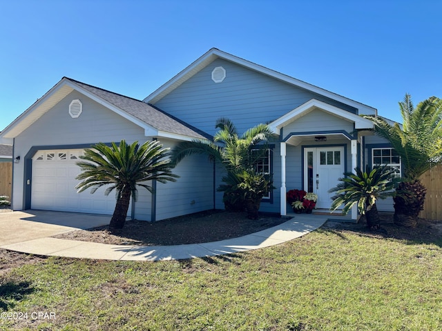 ranch-style home with a garage and a front yard