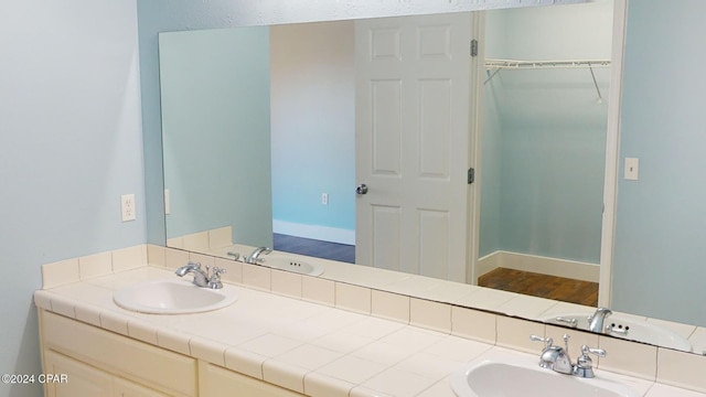 bathroom featuring vanity and hardwood / wood-style flooring