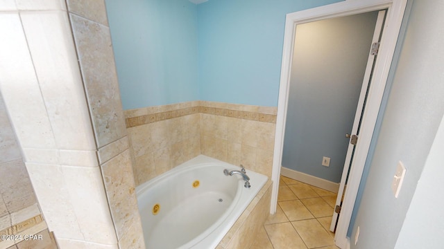 bathroom with tile patterned floors and tiled tub