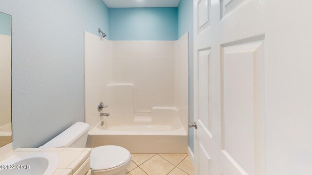 full bathroom featuring tile patterned flooring, vanity,  shower combination, and toilet