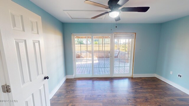 unfurnished room with ceiling fan and dark hardwood / wood-style flooring