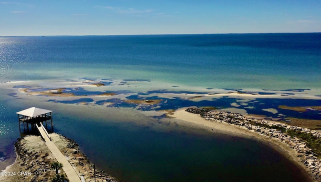 birds eye view of property with a view of the beach and a water view