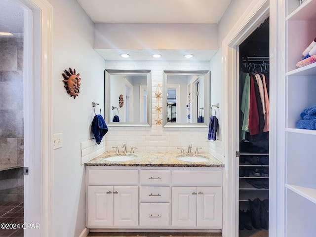 bathroom with vanity and backsplash