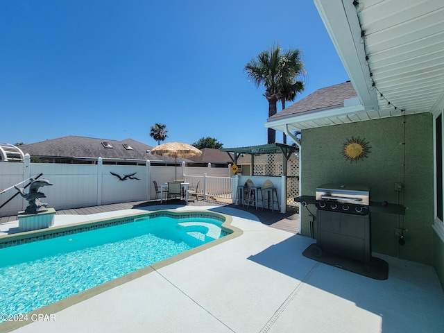 view of pool featuring a patio area and area for grilling