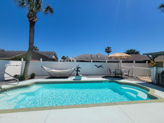 view of swimming pool with a patio area