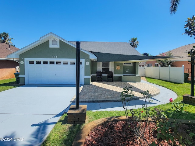 single story home featuring a garage