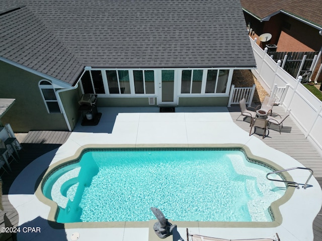 view of swimming pool featuring a patio area