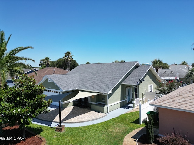 rear view of property with a yard