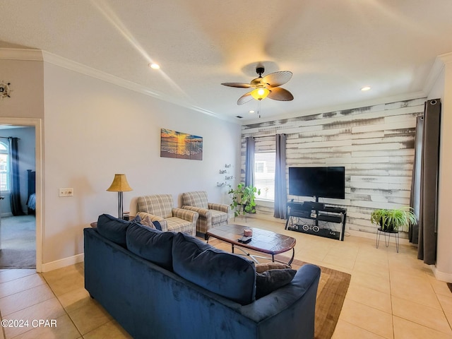 tiled living room featuring a textured ceiling, ceiling fan, and ornamental molding