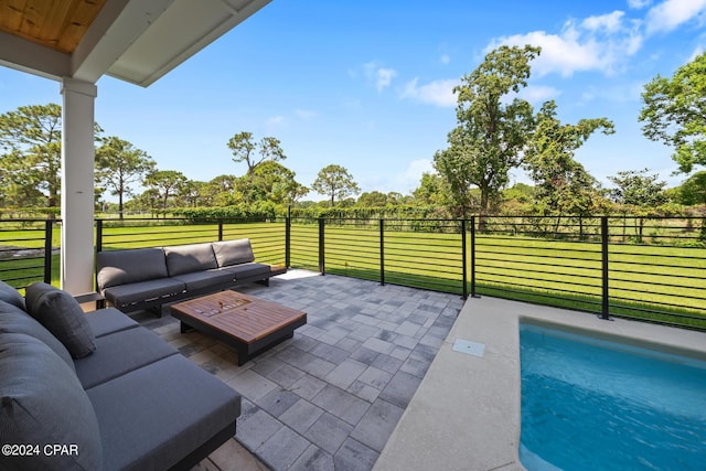 view of patio / terrace featuring a fenced in pool and outdoor lounge area