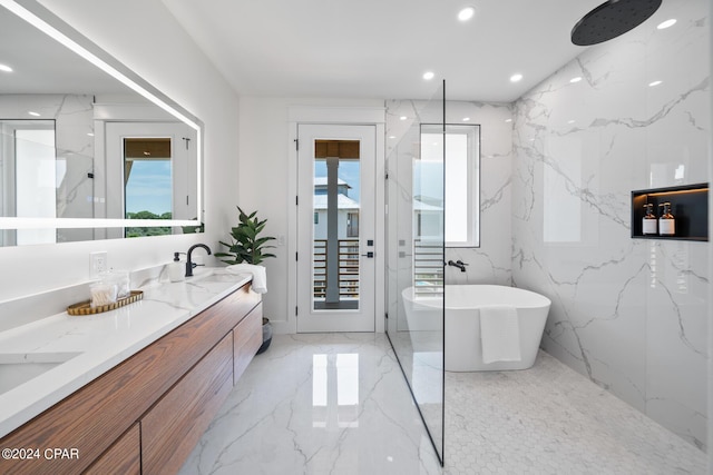 bathroom featuring vanity and separate shower and tub