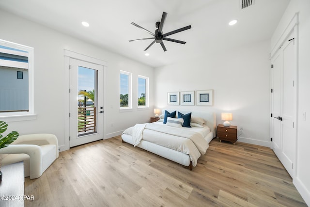 bedroom with ceiling fan, access to outside, and light hardwood / wood-style flooring